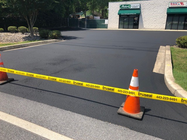 photo of newly sealed commercial parking lot